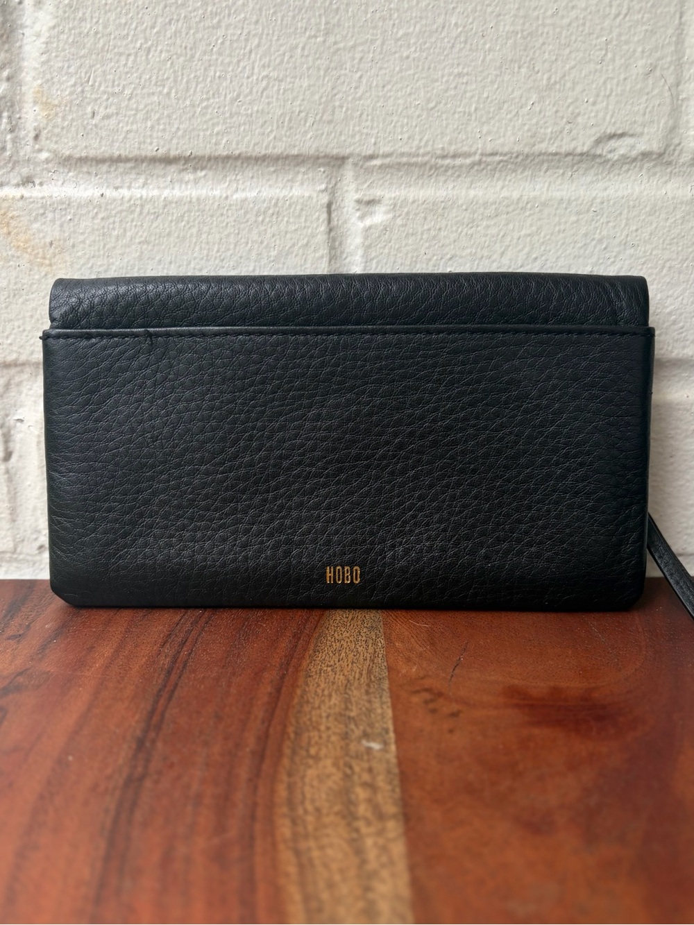 HOBO Embossed Leather Lumen Wallet with Gold Logo in Black